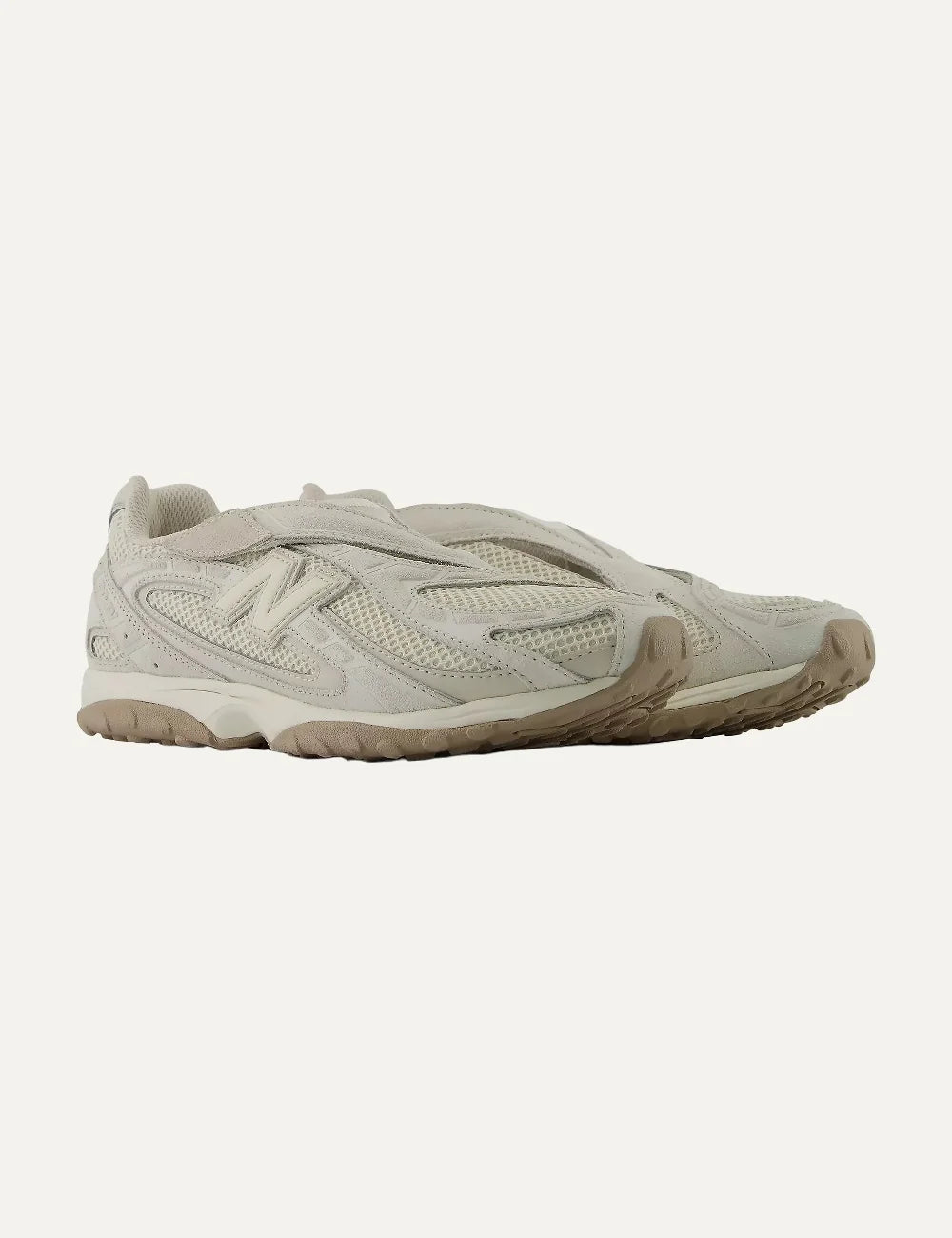 New Balance unisex off-white suede and mesh low profile sneakers angled