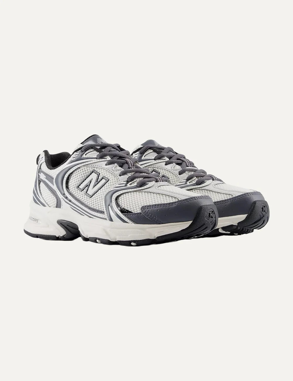 New Balance unisex white and dark grey mesh sneakers with ABZORB cushioning angled