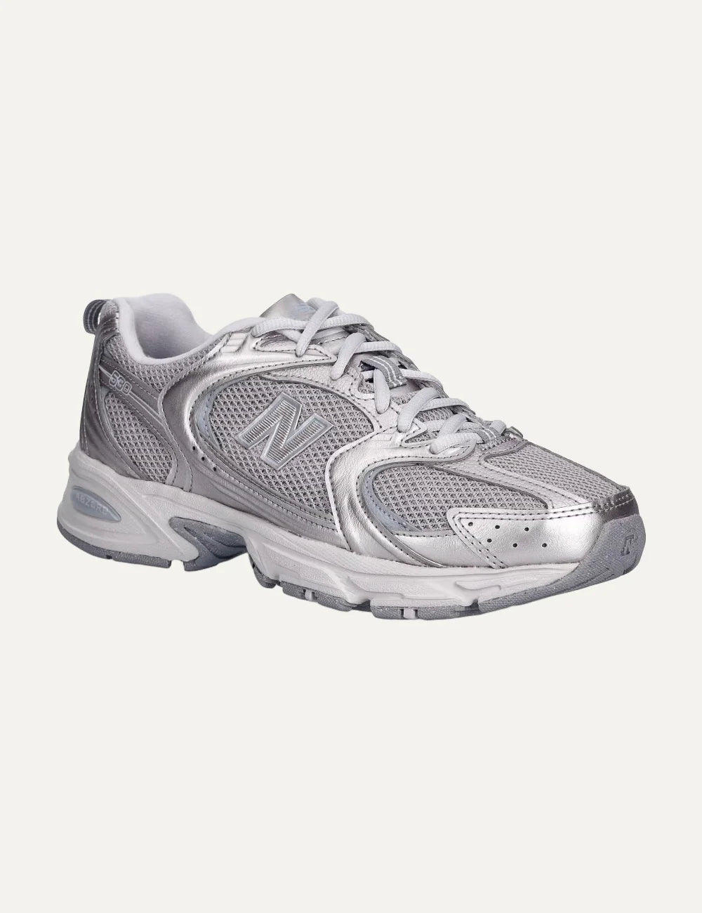 New Balance women's mesh sneakers in metallic silver angled