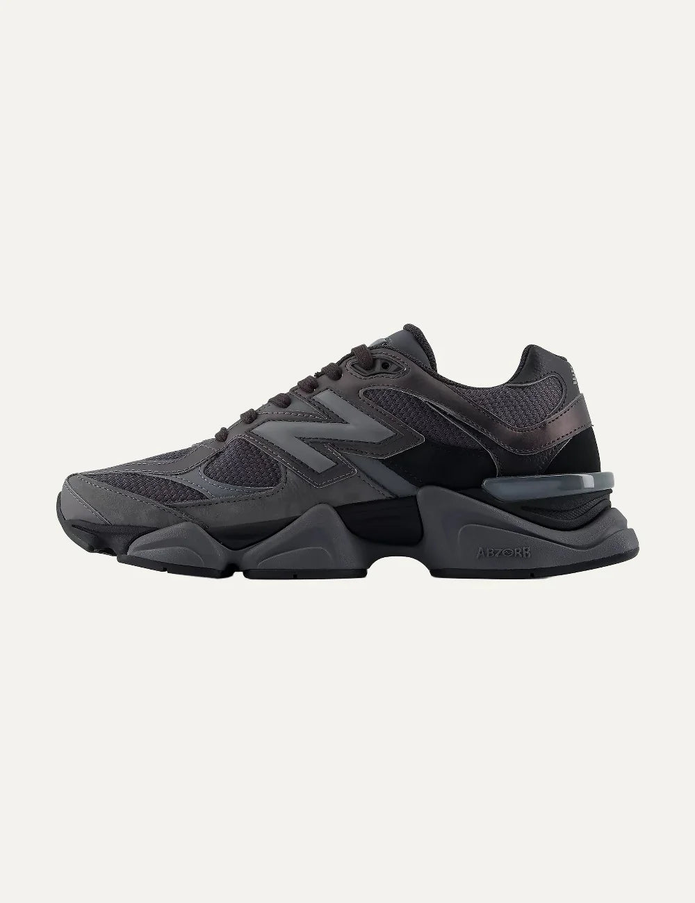 New Balance women's mesh and suede sneakers in dark grey and black profile