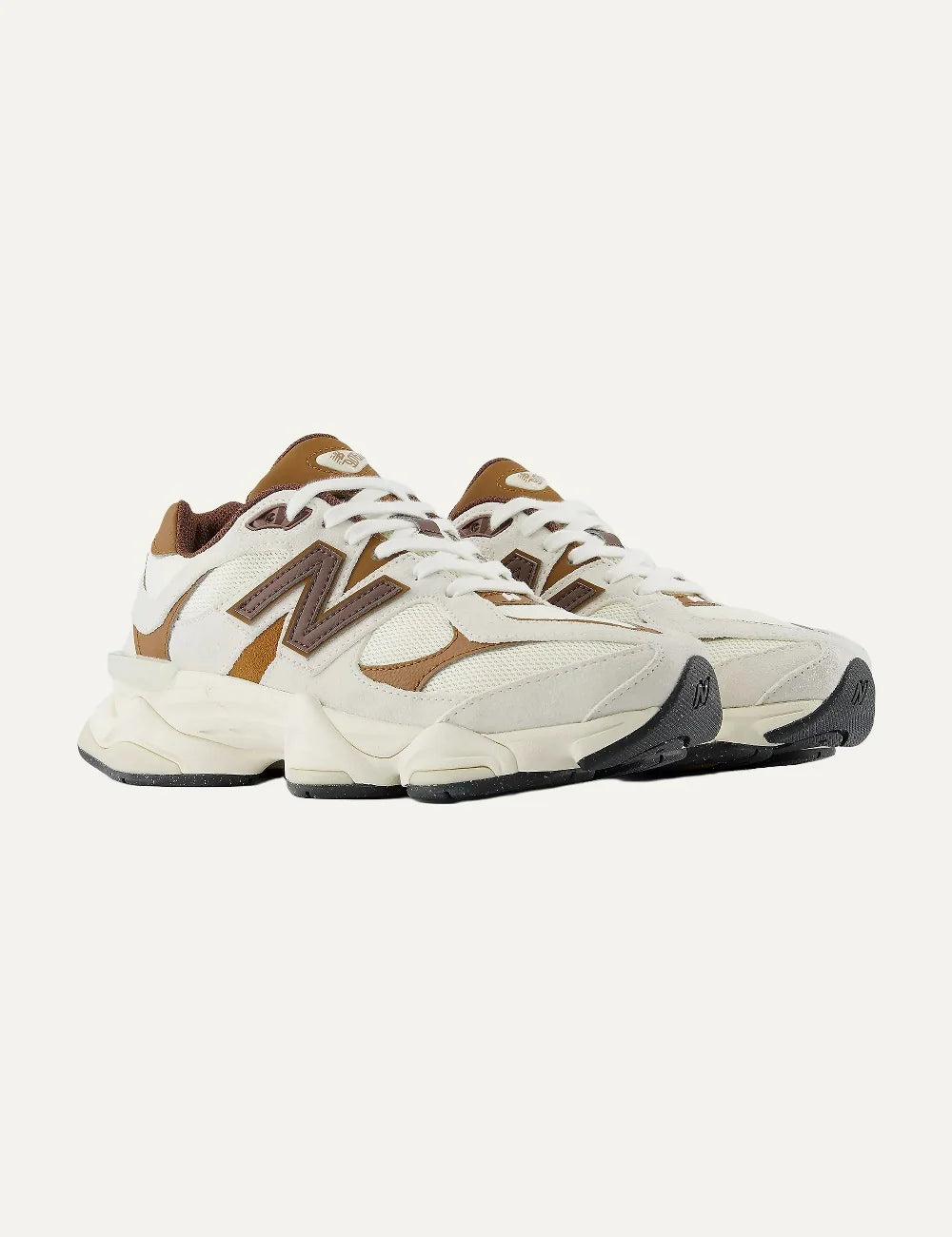 New Balance women's mesh and suede sneakers in off-white with brown details angled