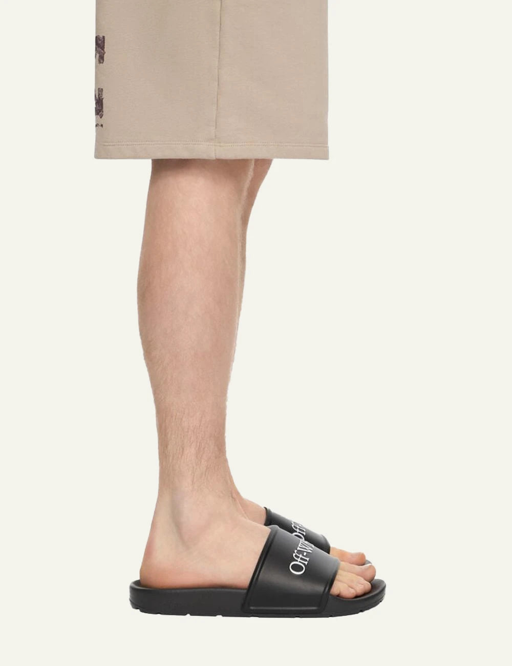 Off-White slider black logo strap flat sandal model view
