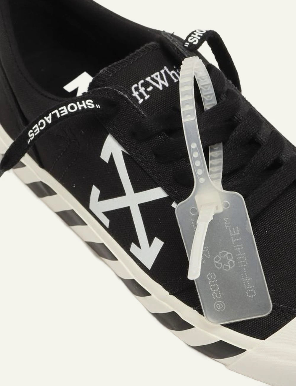 Off-White vulcanized sneakers black canvas arrows logo top detail view