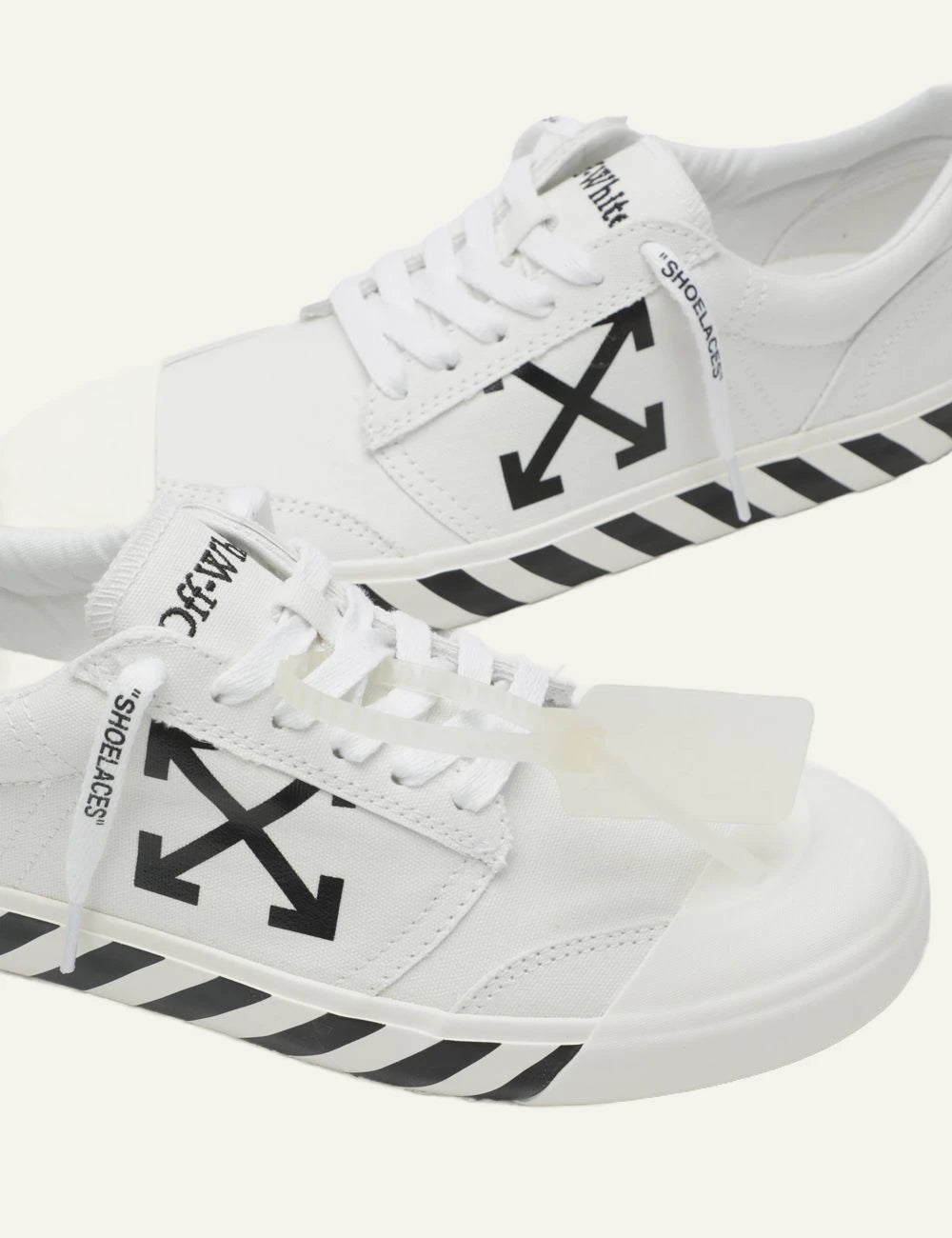 Off-White vulcanized sneakers white arrows logo canvas side detail view