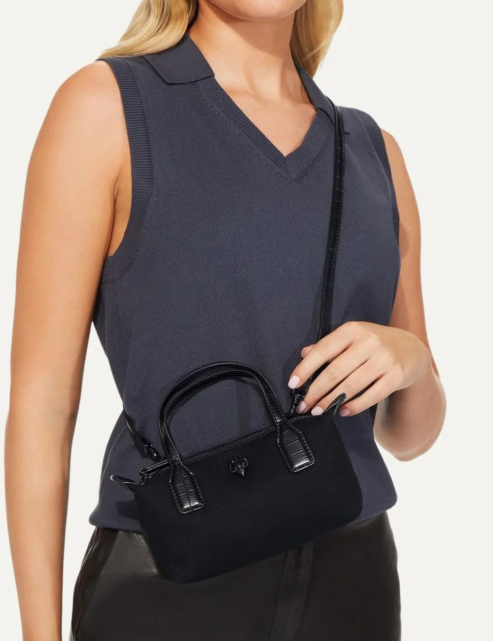 Kurt Geiger London black canvas mini handbag with croc-embossed handles, crystal eagle head detail and detachable crossbody strap model