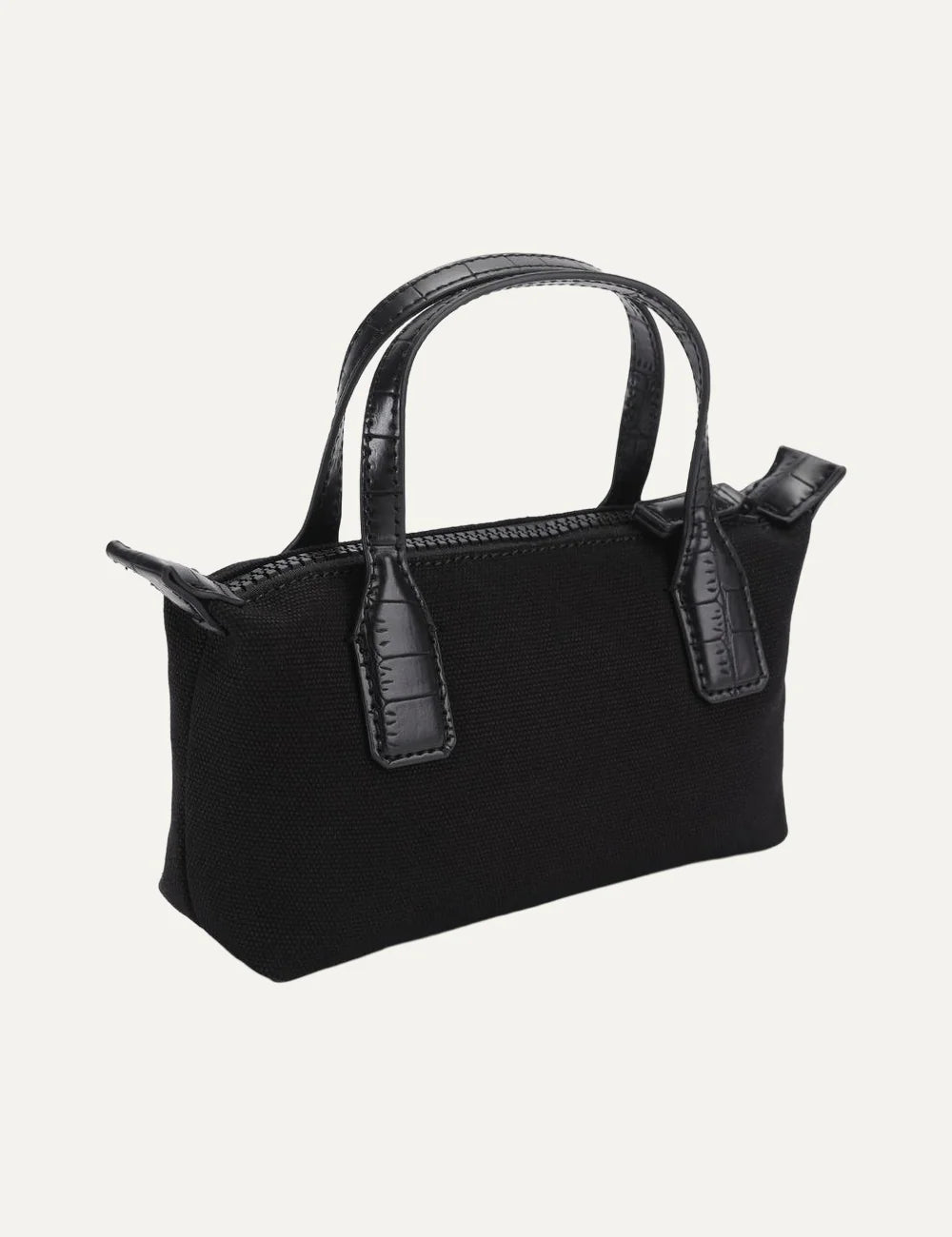 Kurt Geiger London black canvas mini handbag with croc-embossed handles, crystal eagle head detail and detachable crossbody strap side