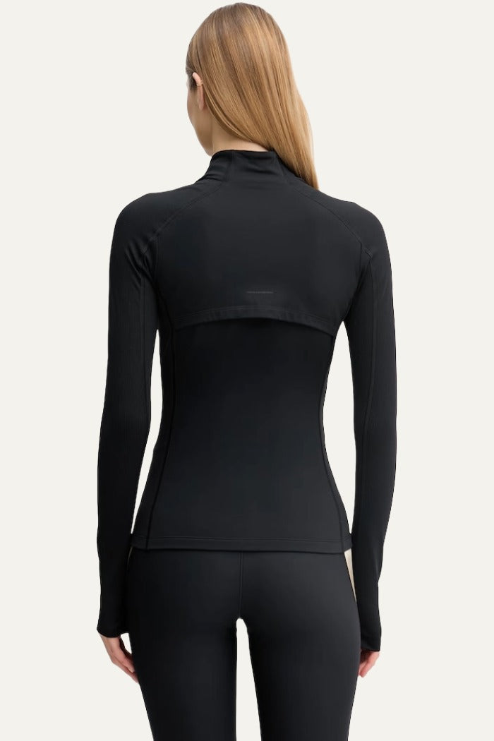 On black women's fitted zip-up sports jacket with fleece lining back