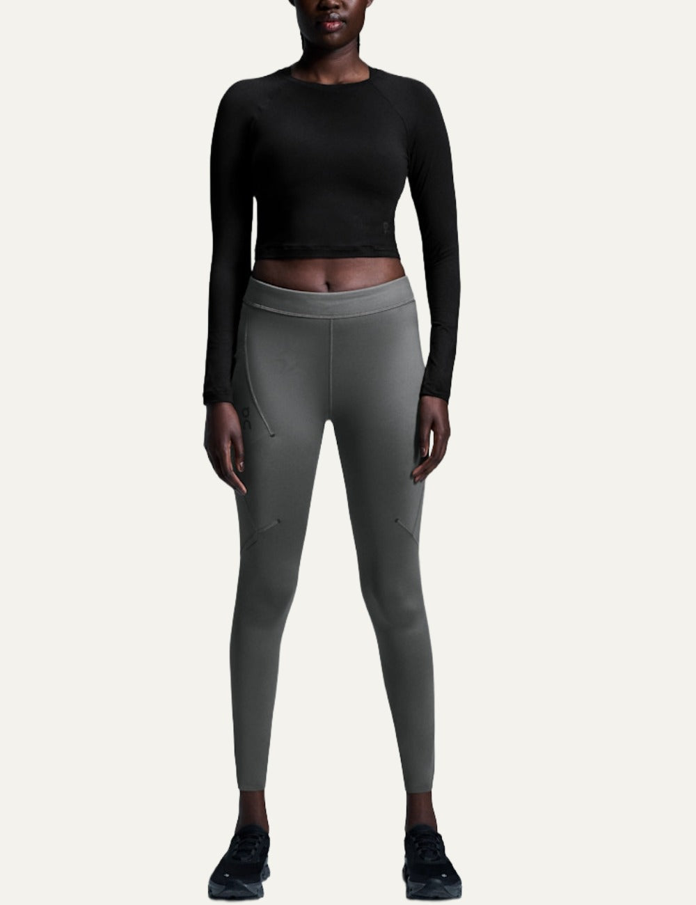 On black women's long sleeve crop training top model