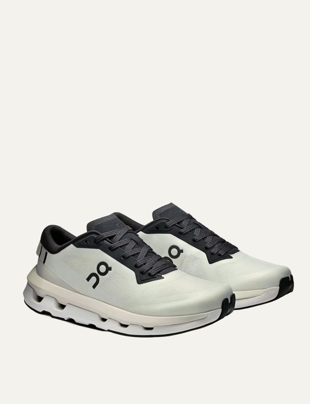 On Cloudzone sneakers in ice and black with breathable upper and CloudTec cushioning angled
