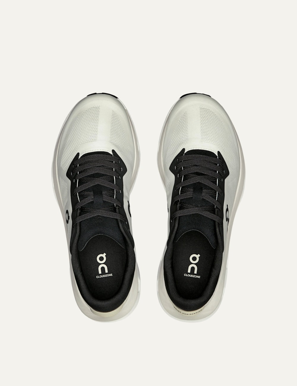 On Cloudzone sneakers in ice and black with breathable upper and CloudTec cushioning top