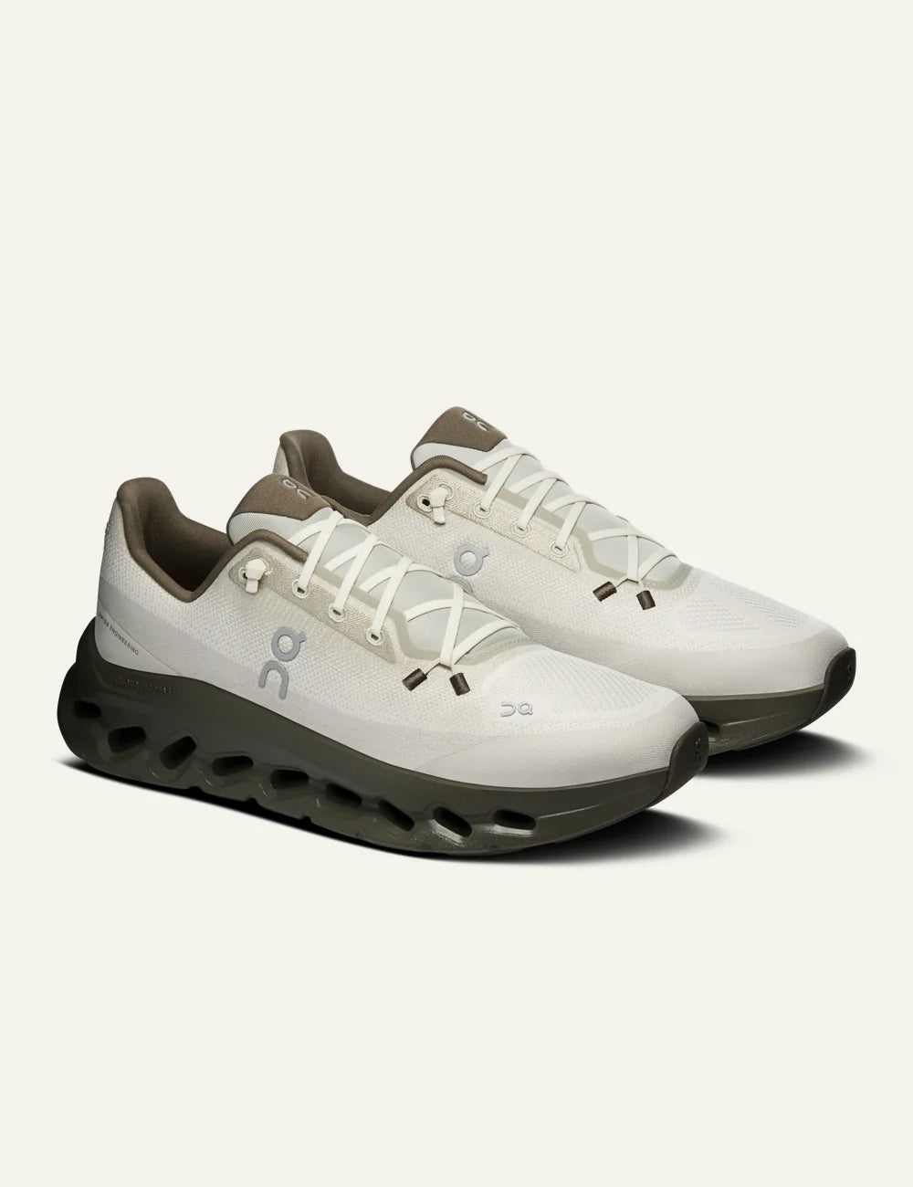 Men's On Cloudtilt Fen Grain white and olive running sneakers with CloudTec Phase cushioning angled
