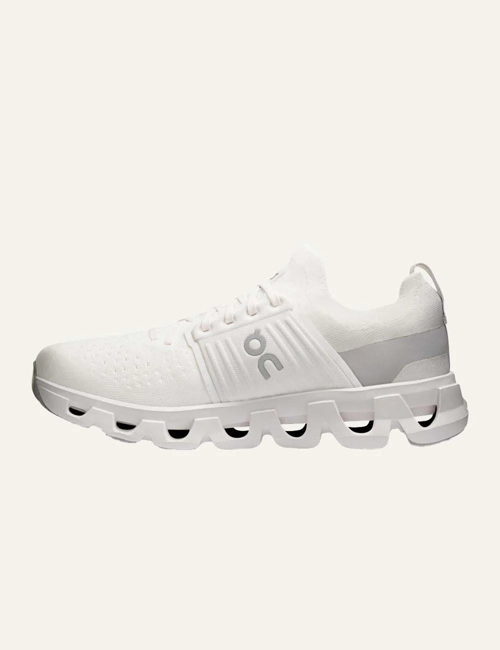 On men's white running sneakers with breathable mesh upper, grey details, CloudTec cushioning and Helion foam profile