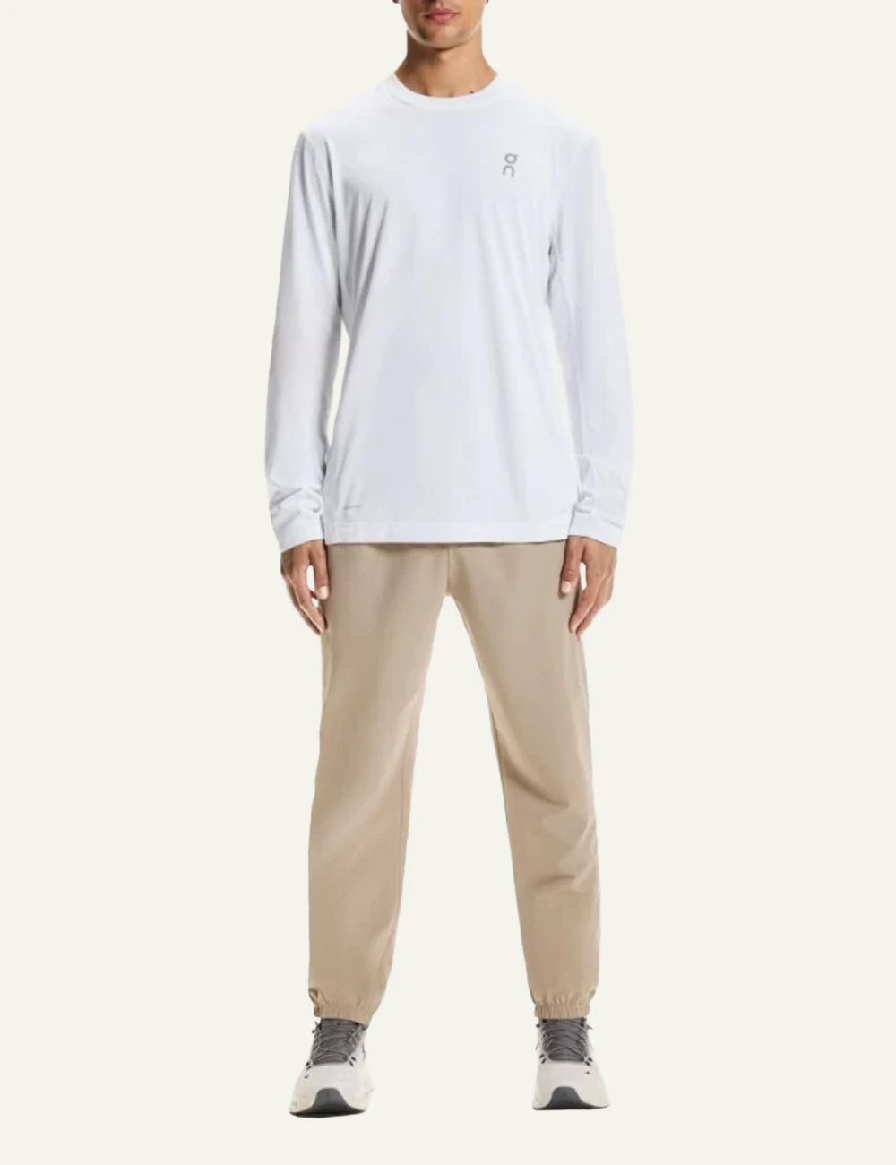 On pants beige athleisure elastic waist tapered leg front full body view