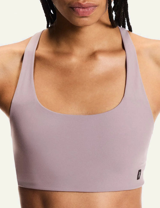 On sports bra back criss-cross front model