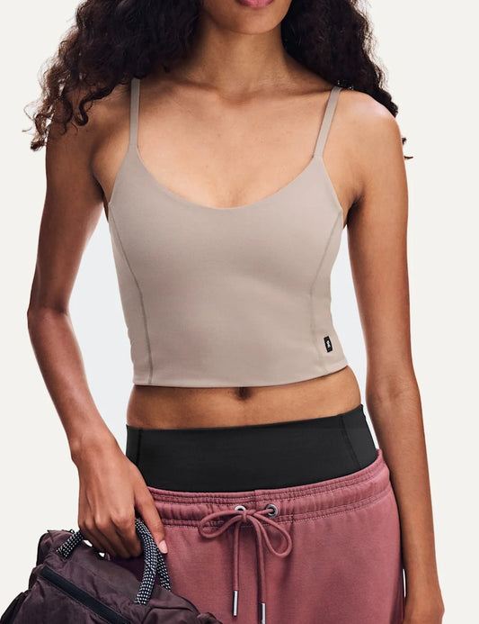 On women's beige cropped athletic tank top with scoop neckline, adjustable thin straps, soft stretchy SenseTec fabric, double-layer construction and fitted silhouette.