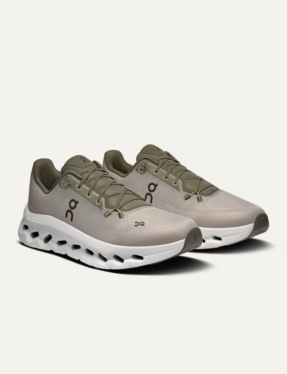 On women's beige mesh sneakers with olive details and CloudTec Phase sole angled
