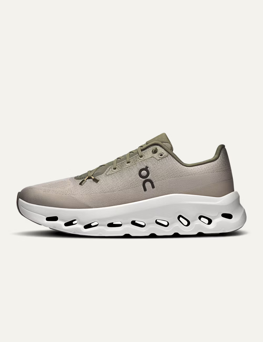 On women's beige mesh sneakers with olive details and CloudTec Phase sole profile