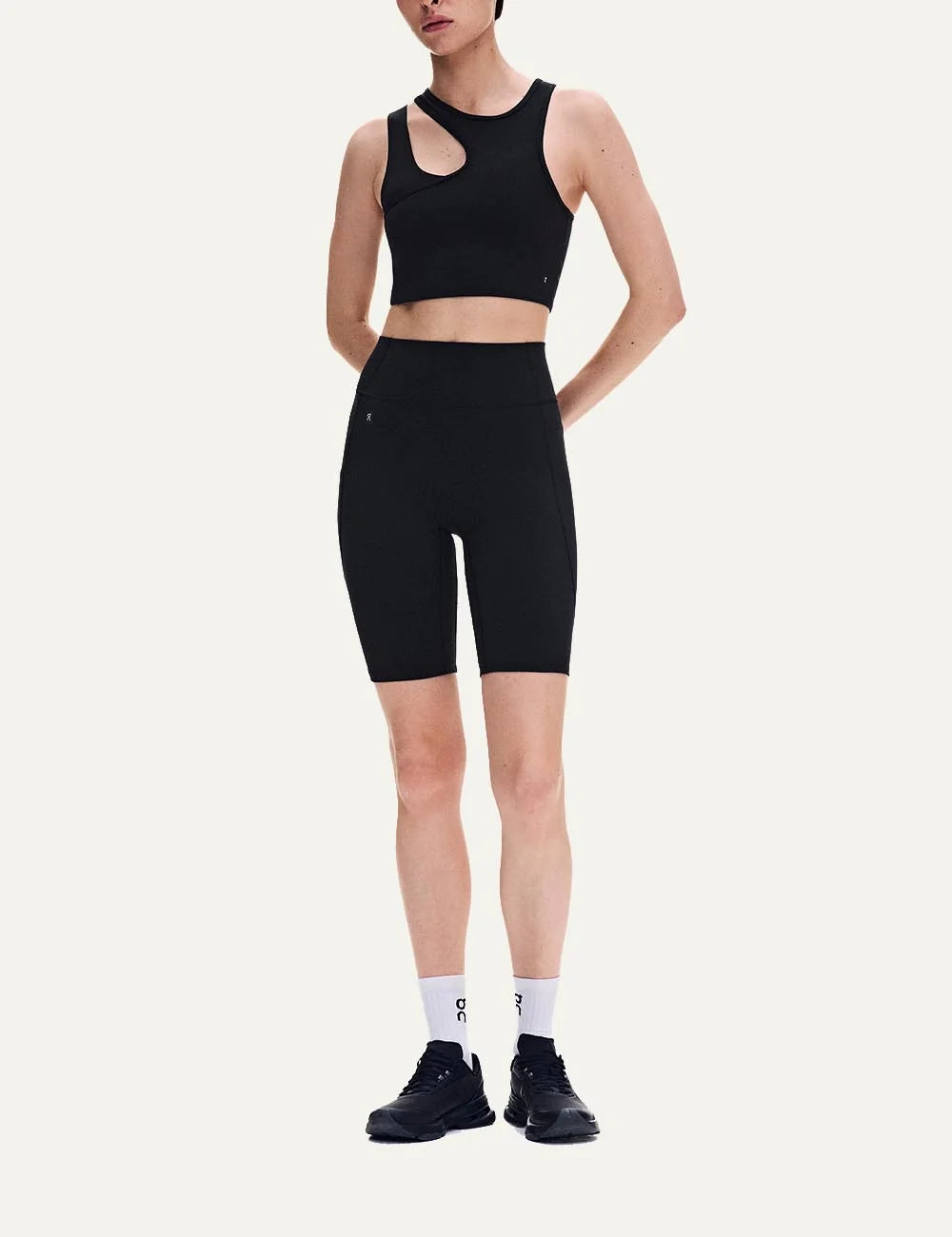 ON women's black asymmetric cropped training top with front cutout