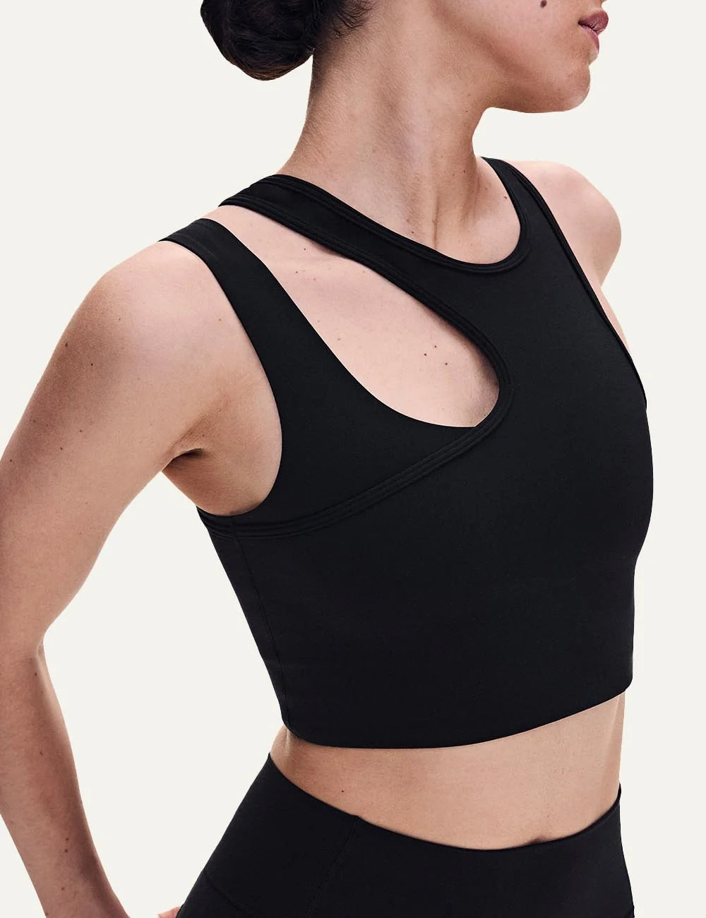 ON women's black asymmetric cropped training top with front cutout side