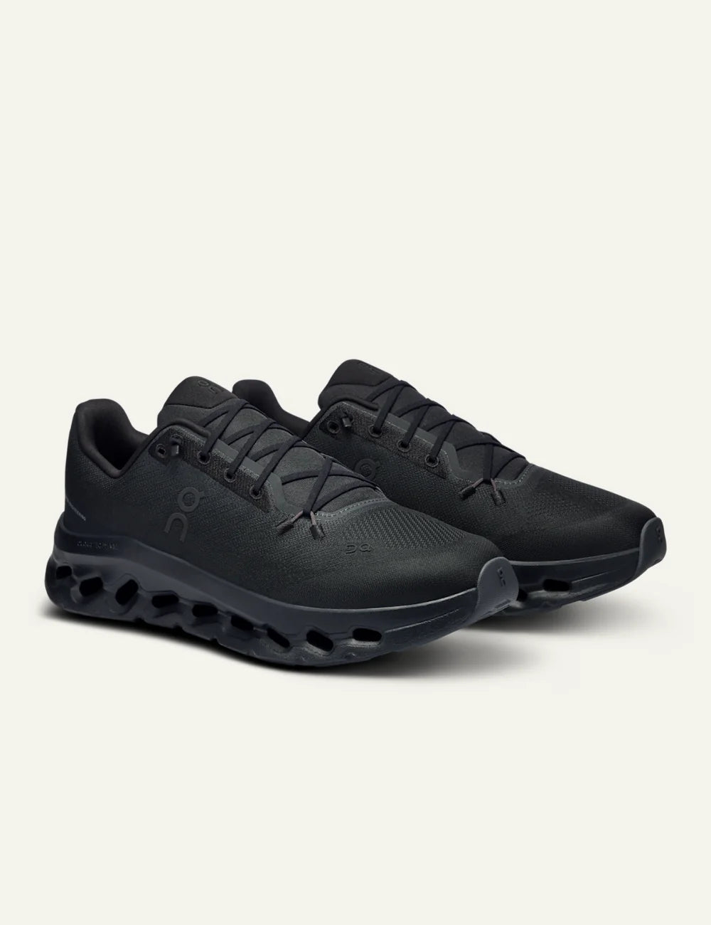 On women's black mesh sneakers with CloudTec Phase cushioned sole angled