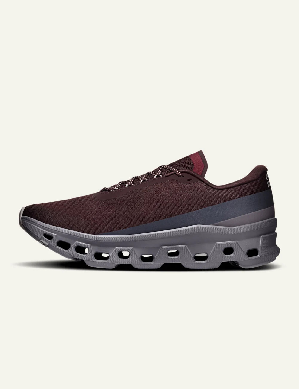 On women's burgundy sneakers with grey CloudTec cushioned sole profile