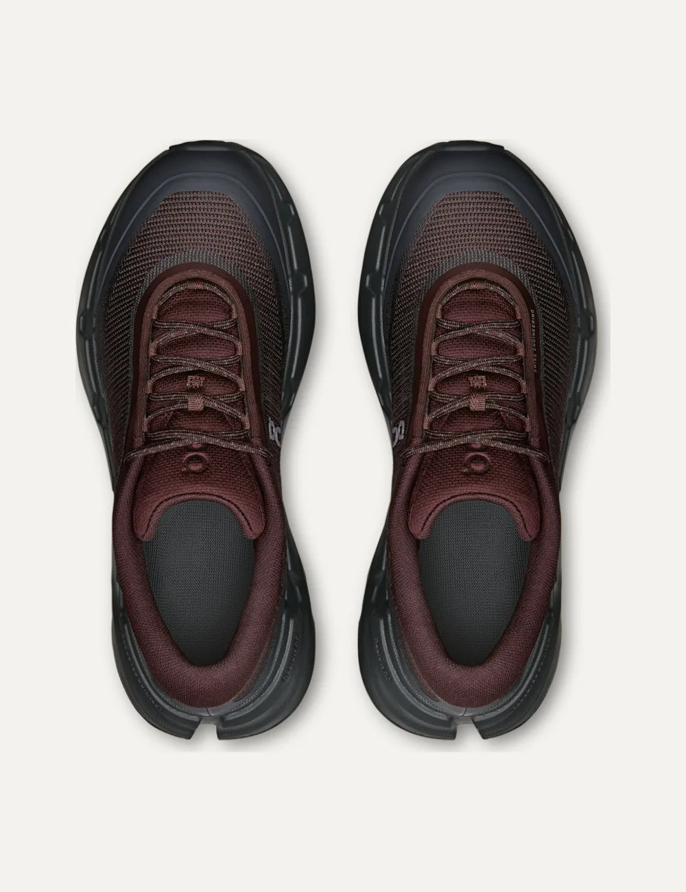 On women's burgundy and dark grey hiking sneakers with mesh upper, CloudTec Connect cushioning and Missiongrip outsole top
