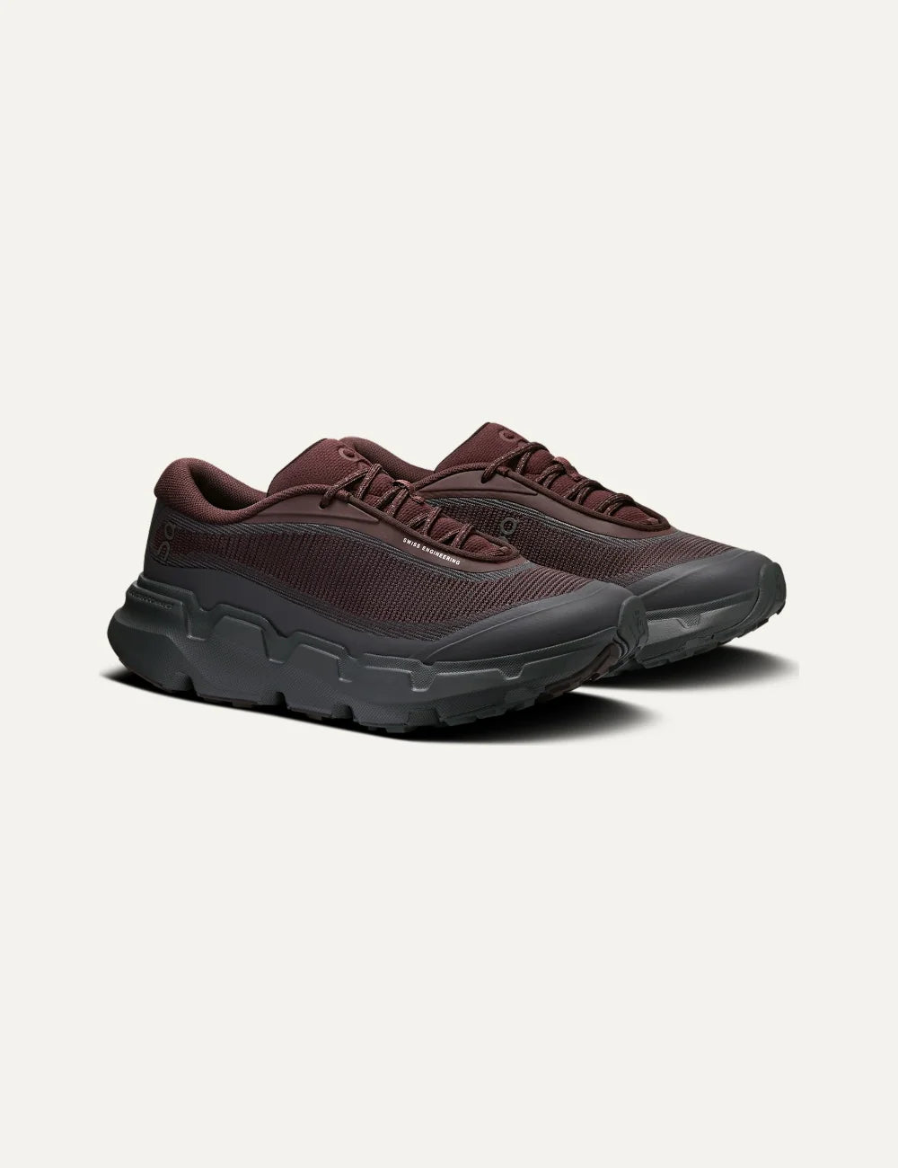 On women's burgundy and dark grey hiking sneakers with mesh upper, CloudTec Connect cushioning and Missiongrip outsole profile