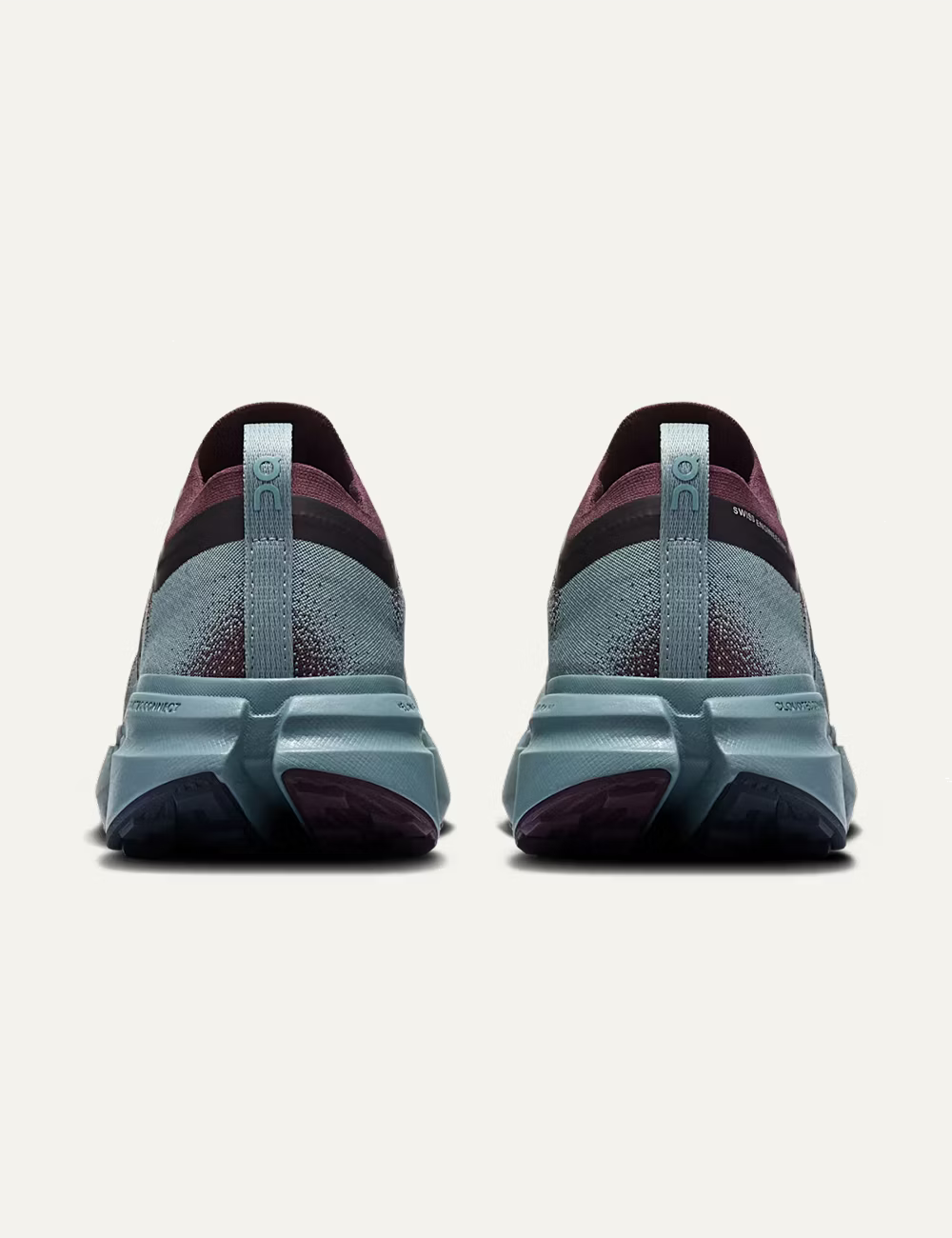 On women's burgundy and light blue technical knit running sneakers back