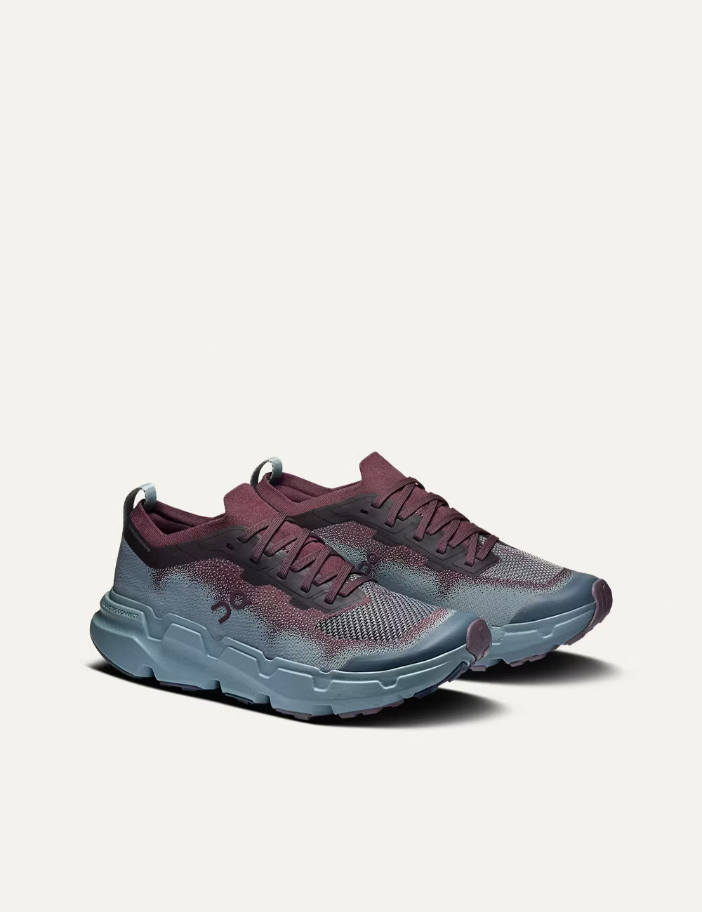 On women's burgundy and light blue technical knit running sneakers angled