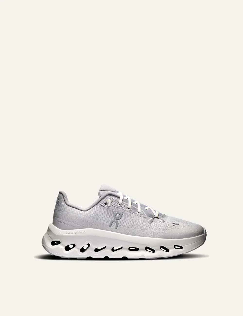 On women's grey Cloudsurfer sneakers with textile upper, speed laces and white CloudTec Phase cushioned sole.
