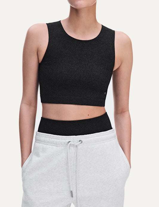 On women's dark grey heathered crop athletic top with sleeveless design, round neckline, soft textured knit, four-way stretch fabric and bonded edges.