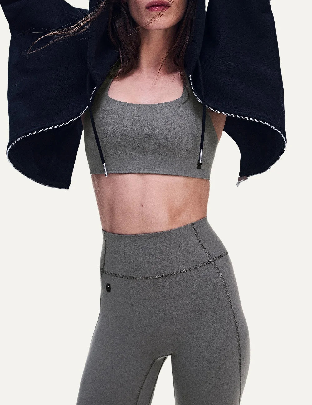 ON women's grey brown high-waisted 7/8 stretch training leggings model