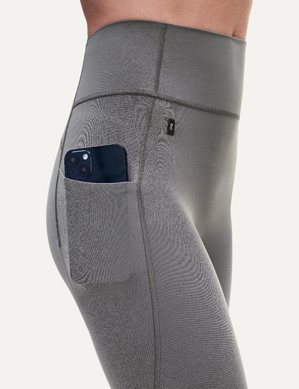ON women's grey brown high-waisted 7/8 stretch training leggings side