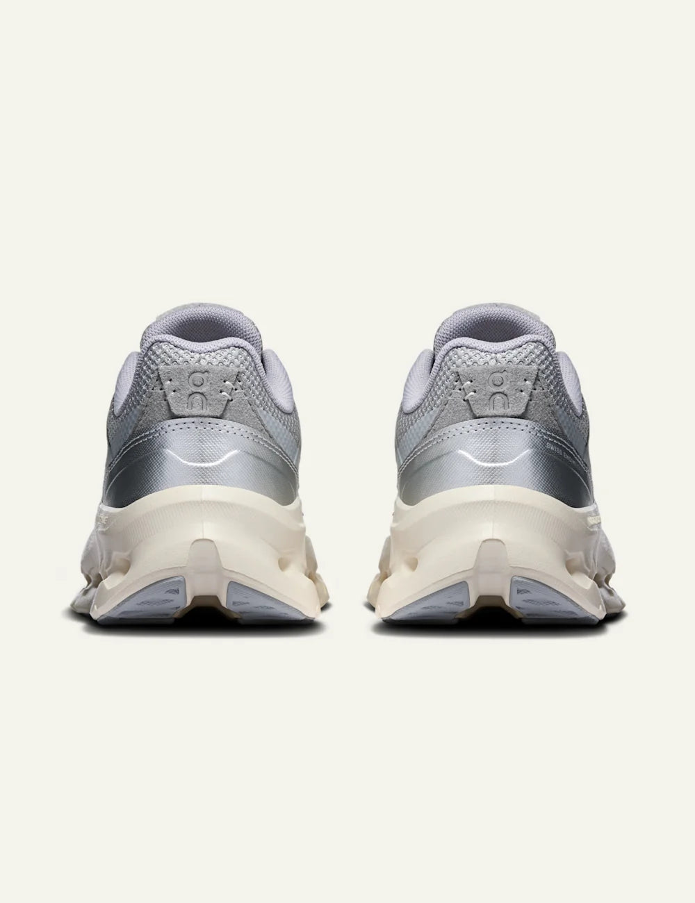 On women's light grey mesh sneakers with chunky cushioned sole back