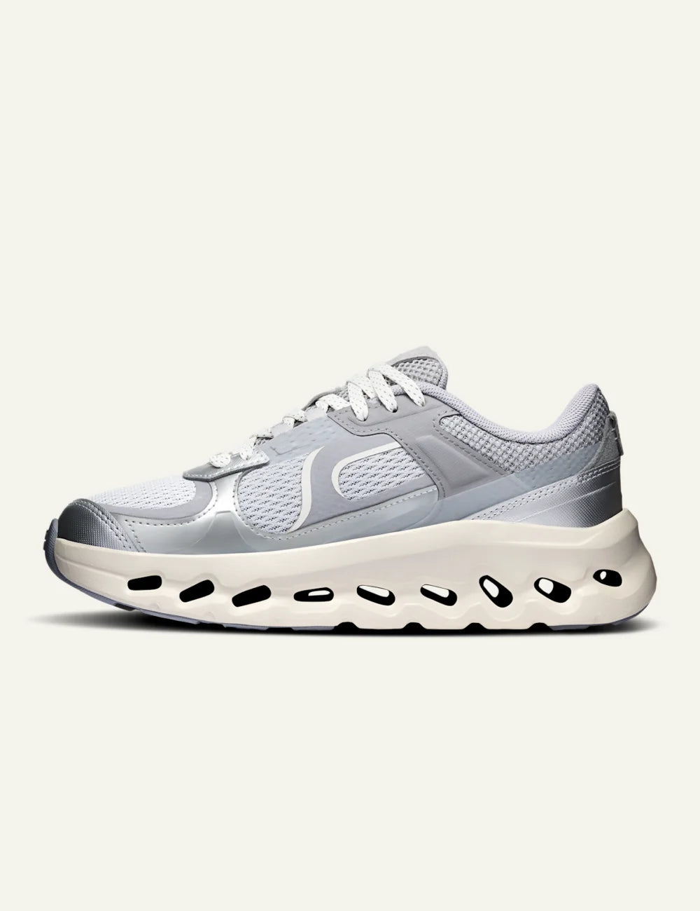 On women's light grey mesh sneakers with chunky cushioned sole profile