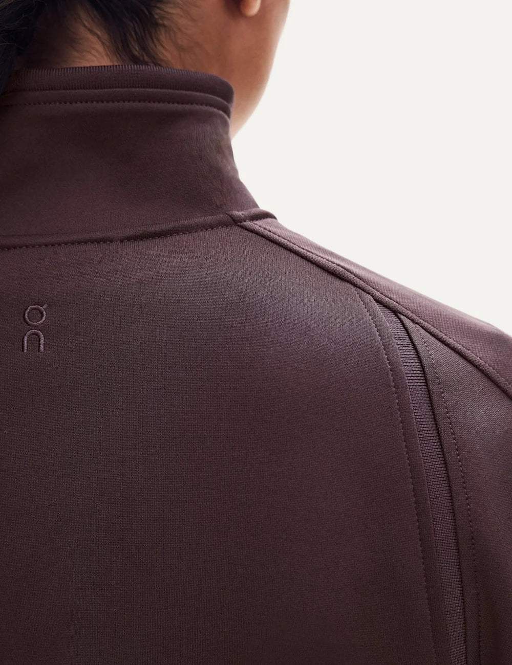 On women's Mulberry brown full-zip tennis-inspired jacket back detail
