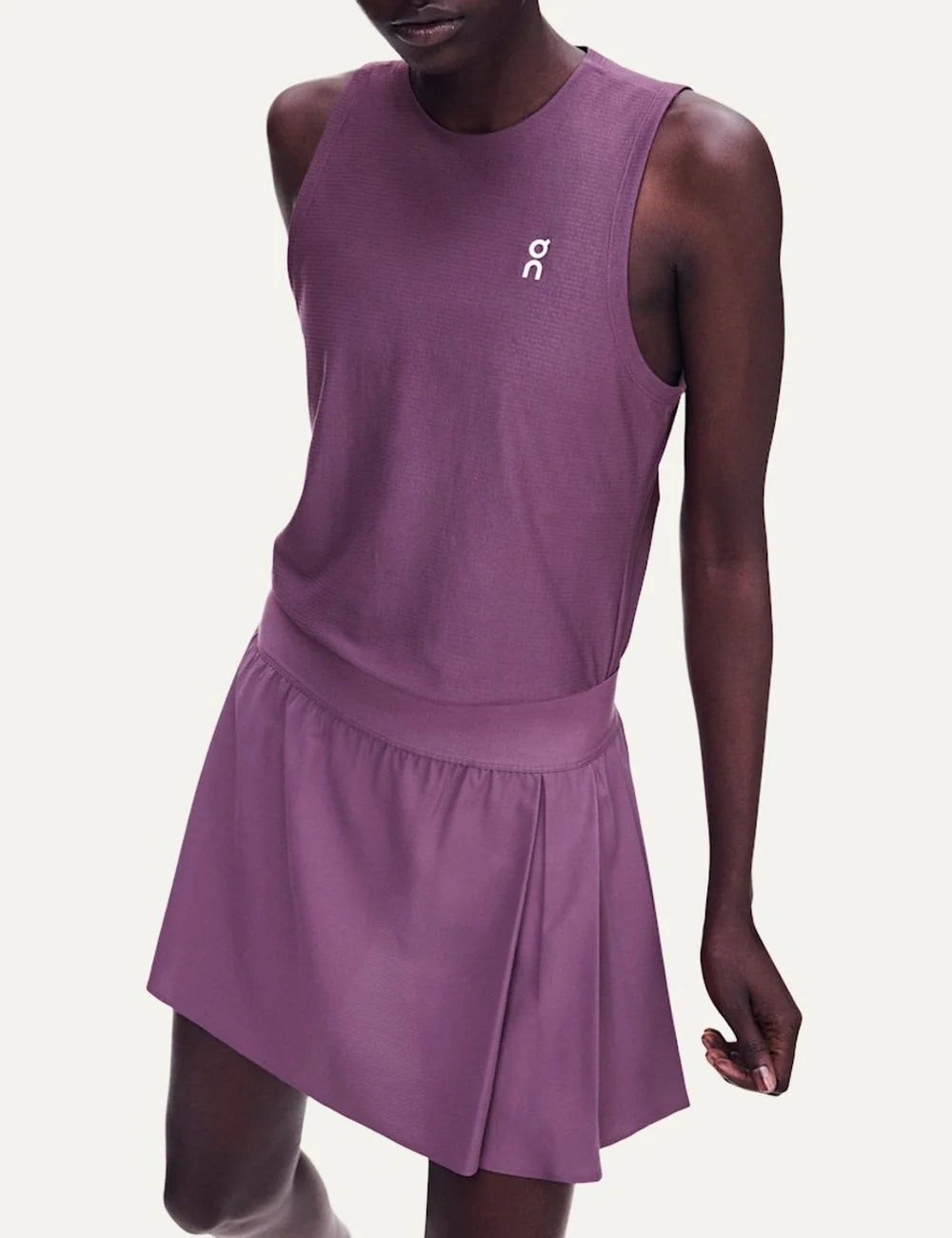 On women's purple pleated tennis skirt with integrated inner shorts model