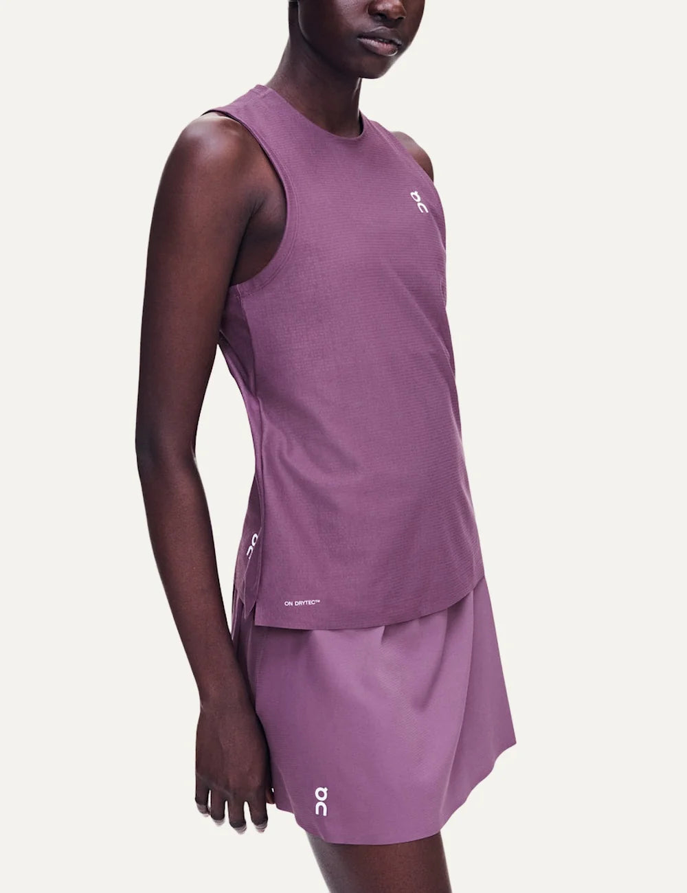 On women's purple pleated tennis skirt with integrated inner shorts side