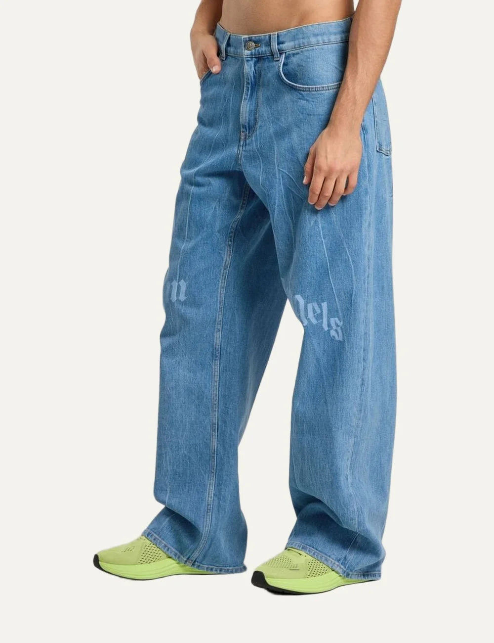 Palm Angels men's light blue washed loose fit jeans with wide straight legs, five-pocket design and split gothic Palm Angels logo across the front thighs side