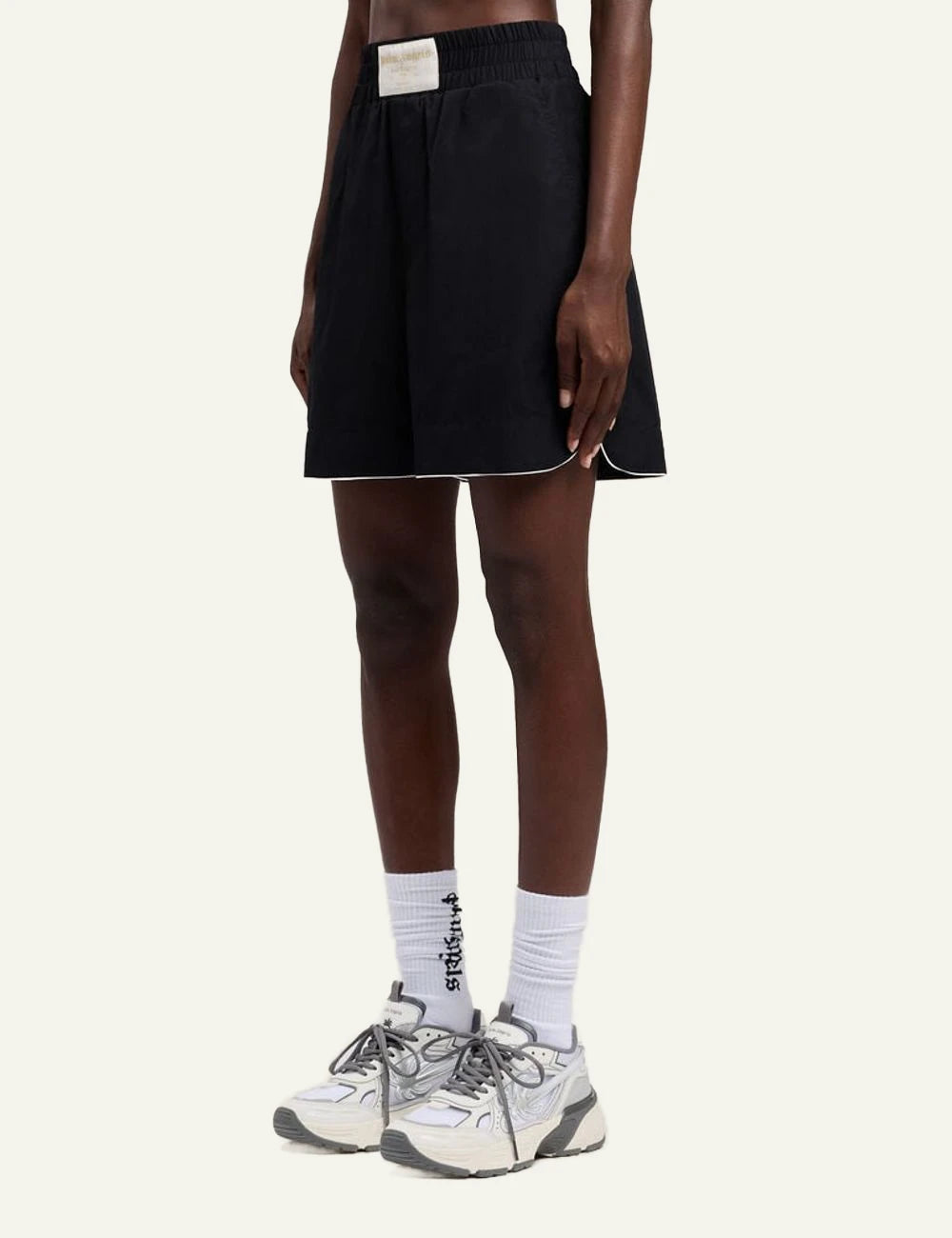 Palm Angels shorts black piping hem elastic waist side view