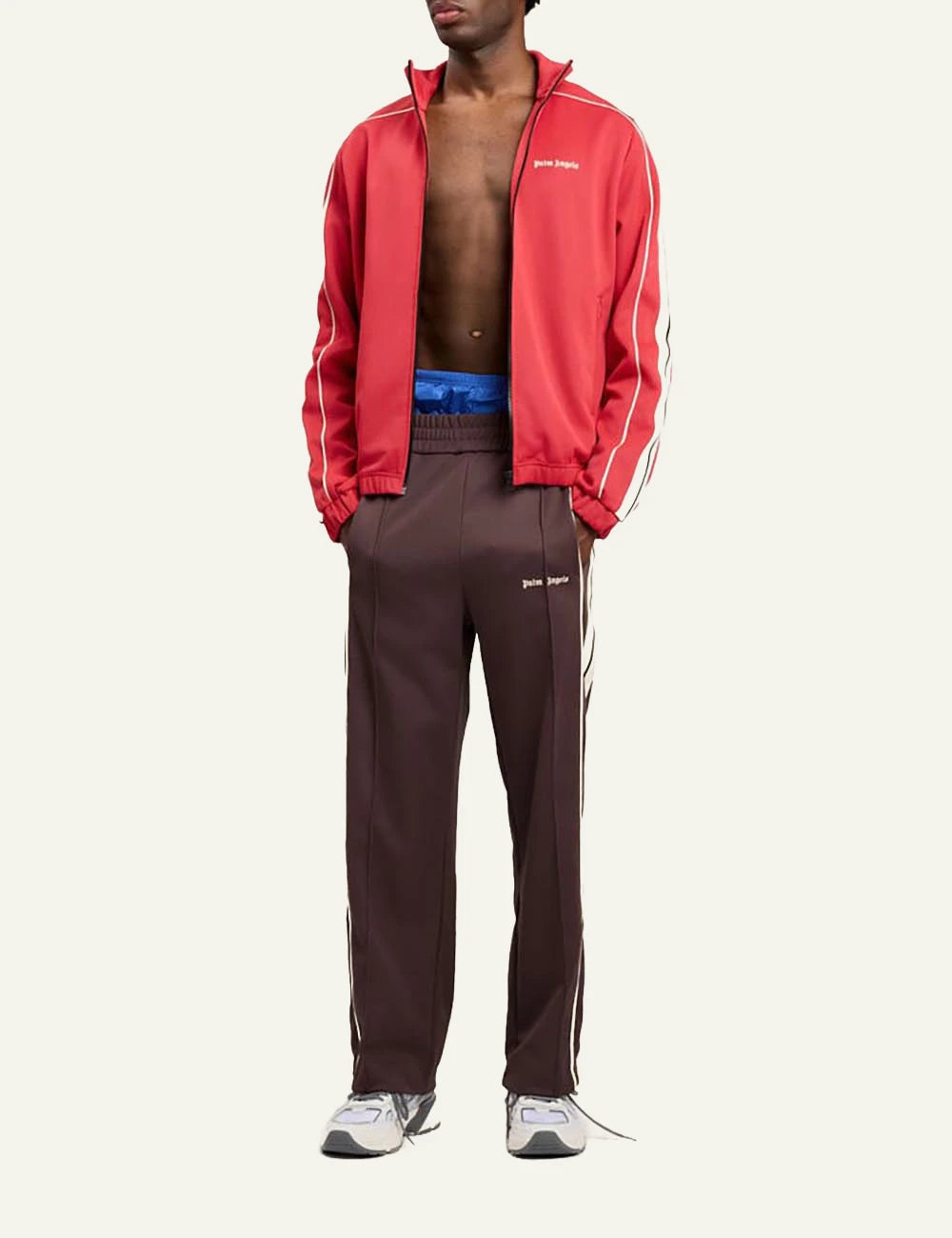 palm angels track pants brown stripe logo front full body view