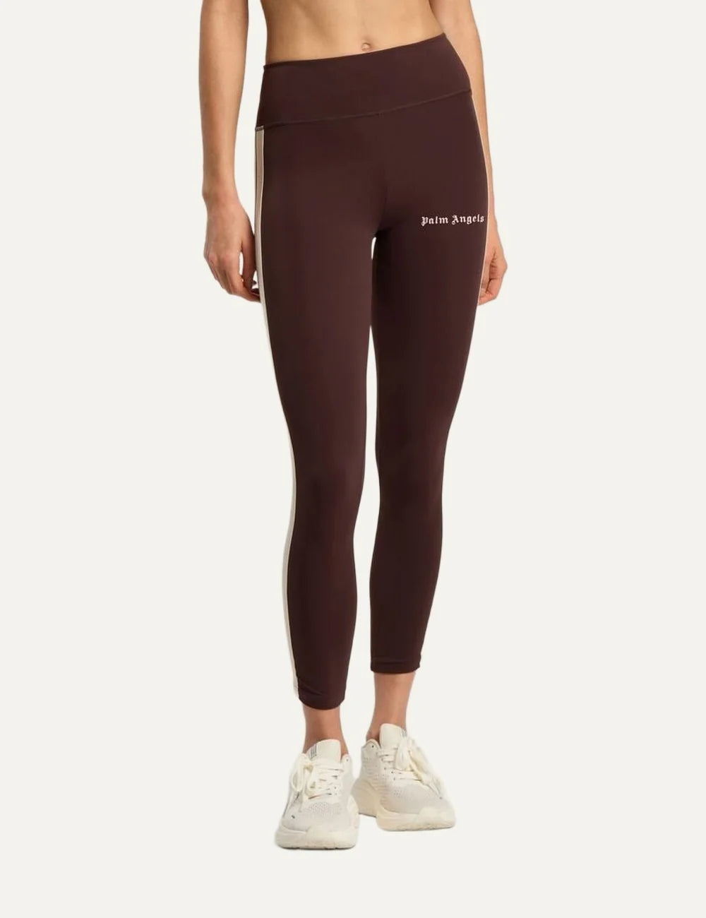 Palm Angels women's dark brown high-waisted leggings with cream side stripes, a wide waistband and white gothic logo on the front thigh model