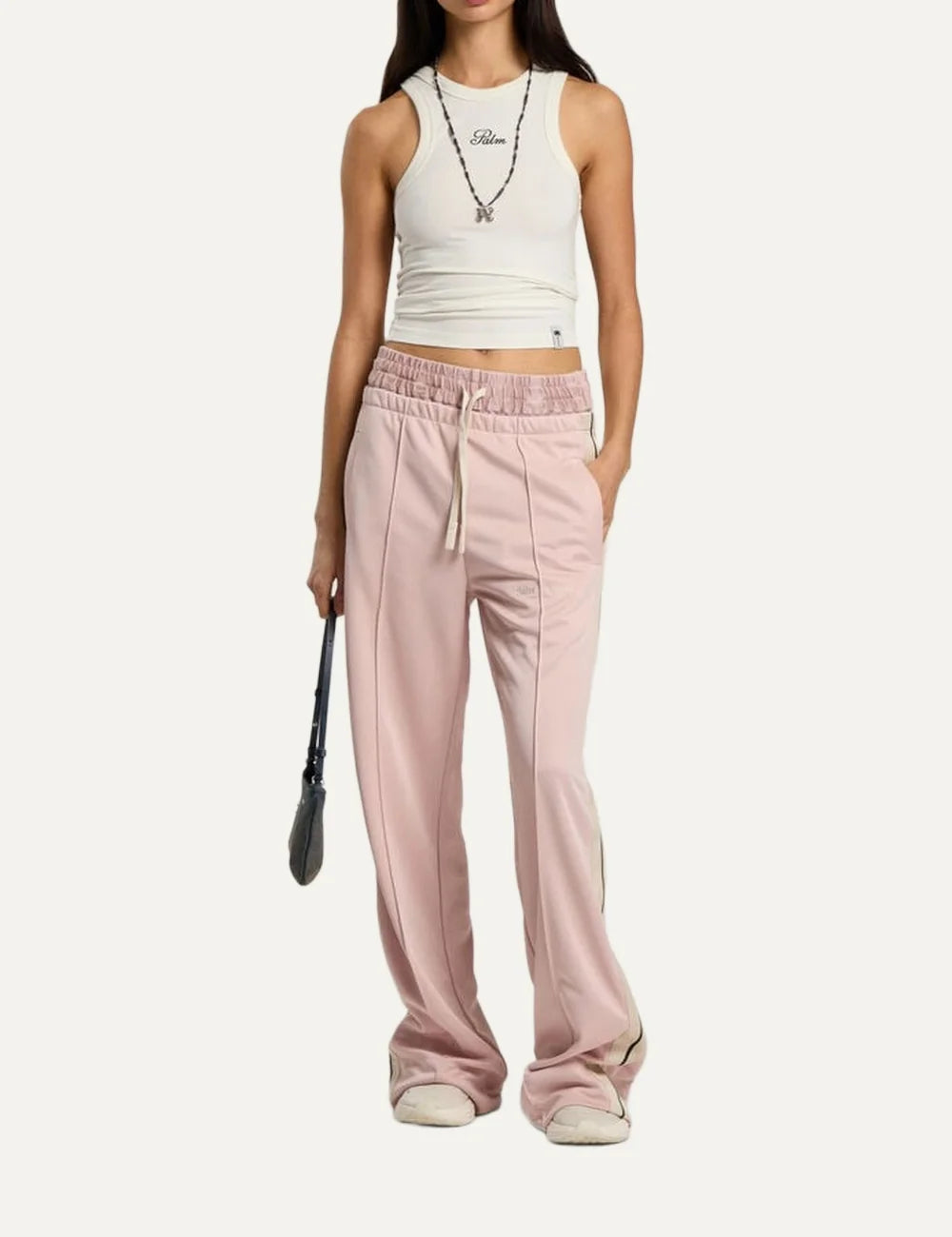 Palm Angels women's light pink wide leg track pants with black and white side stripes, elastic waistband, front pintuck pleats and embroidered logo full body