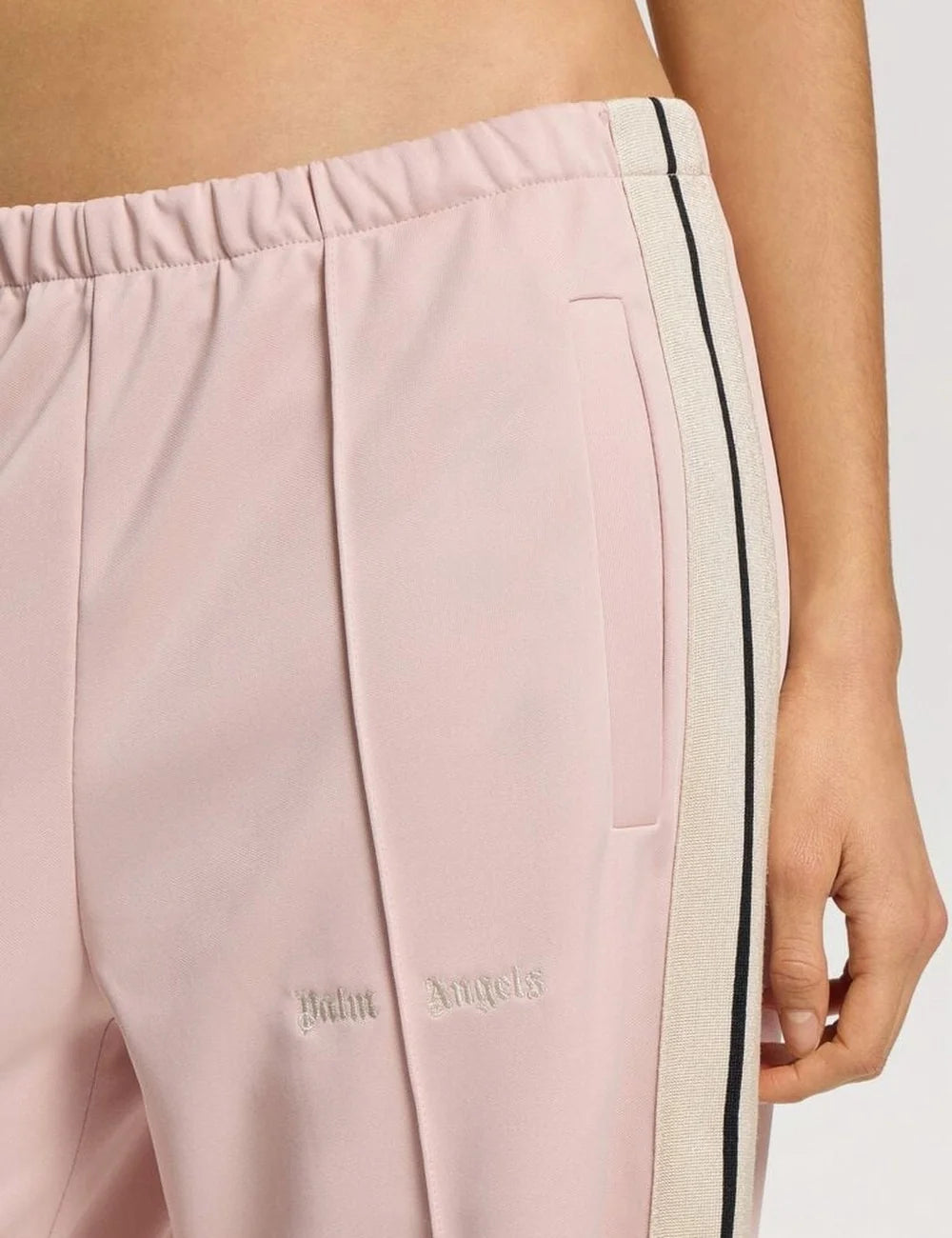 Palm Angels women's light pink wide leg track pants with black and white side stripes, elastic waistband, front pintuck pleats and embroidered logo detail