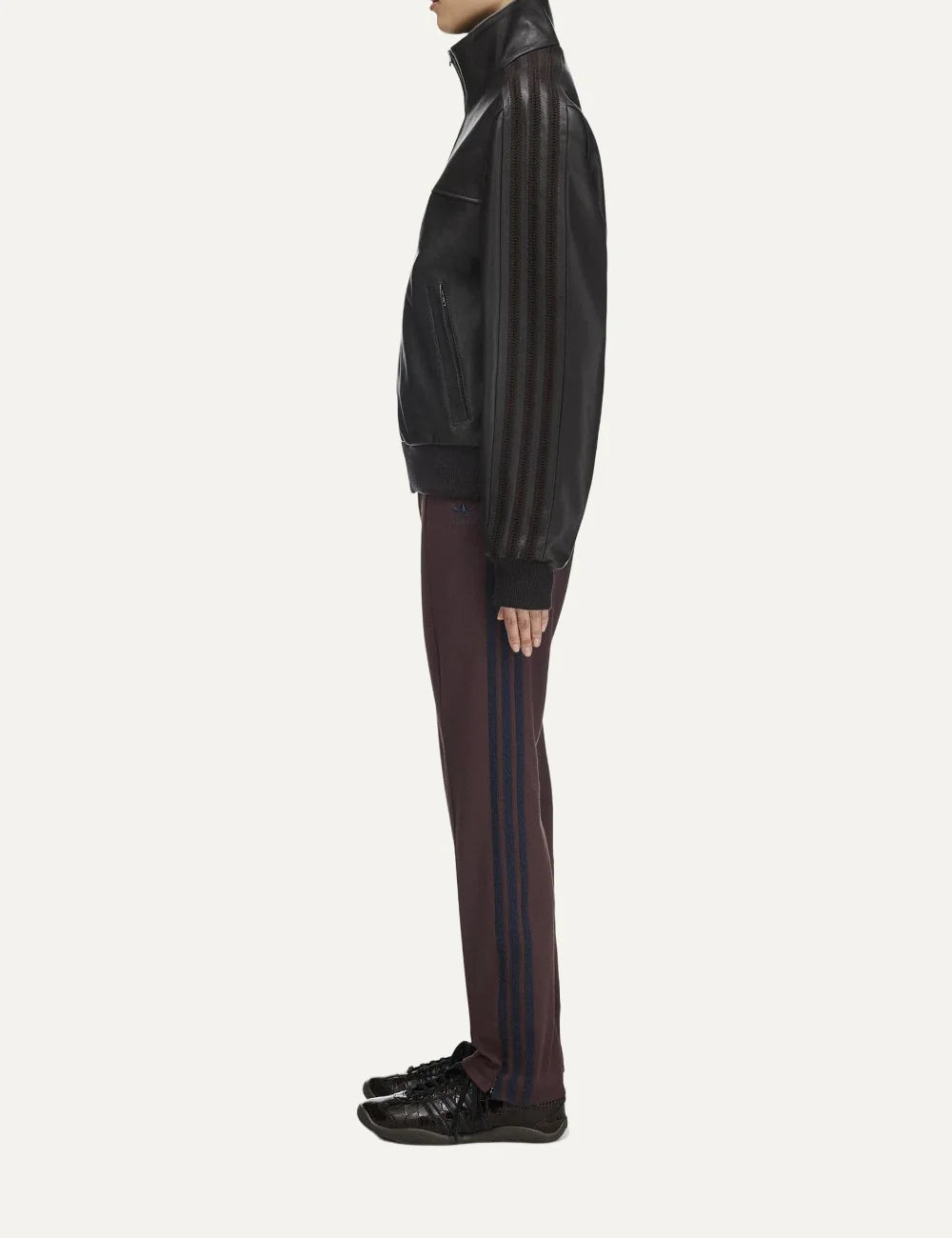 Women's Adidas Originals x Wales Bonner slim fit burgundy track pants with navy side stripes, Trefoil logo, front seams and stirrup hems, side view