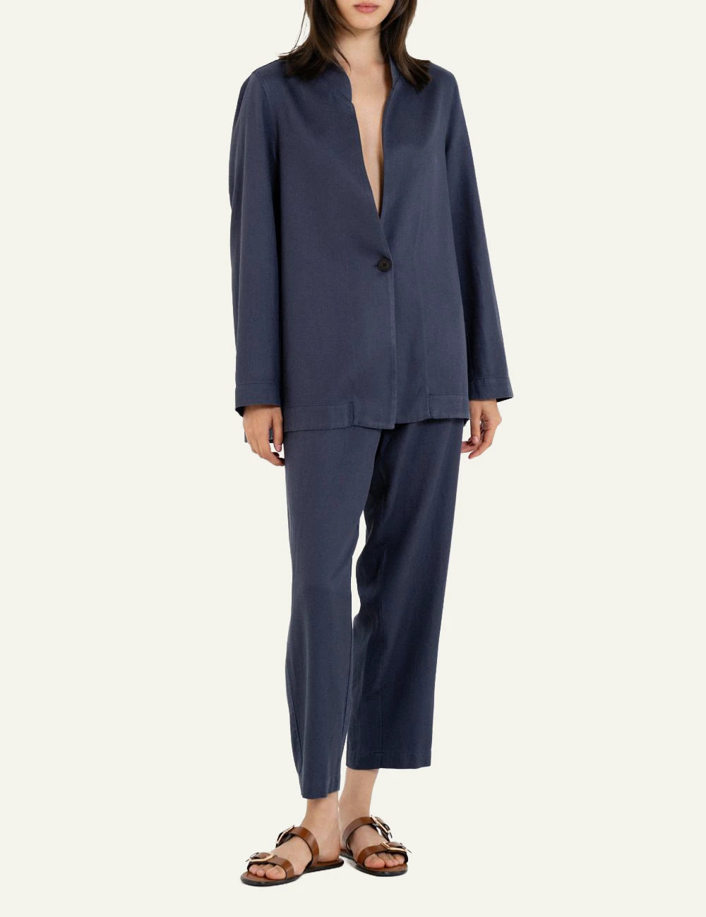 Philosophy navy blazer worn with matching trousers front view