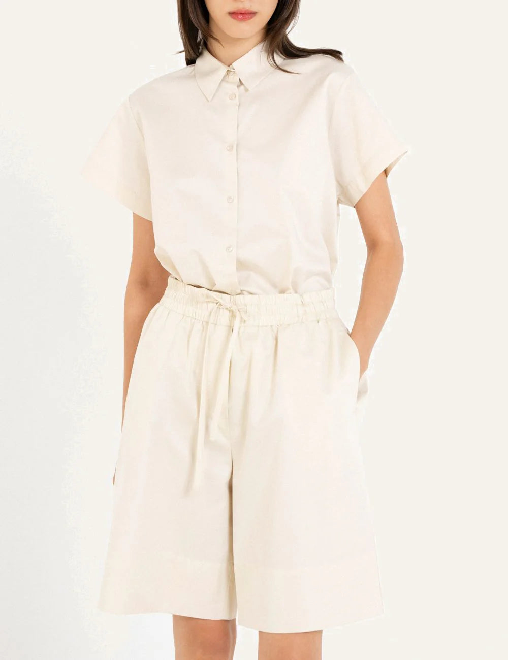 Philosophy cream poplin shorts worn on model front view