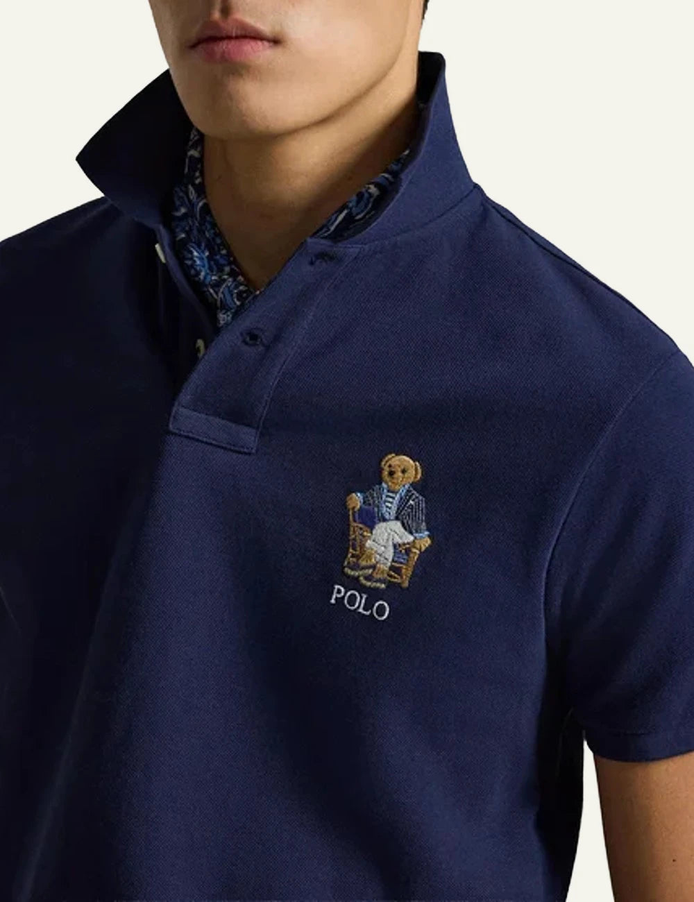 Polo Ralph Lauren navy polo shirt with Polo Bear embroidery front detail view