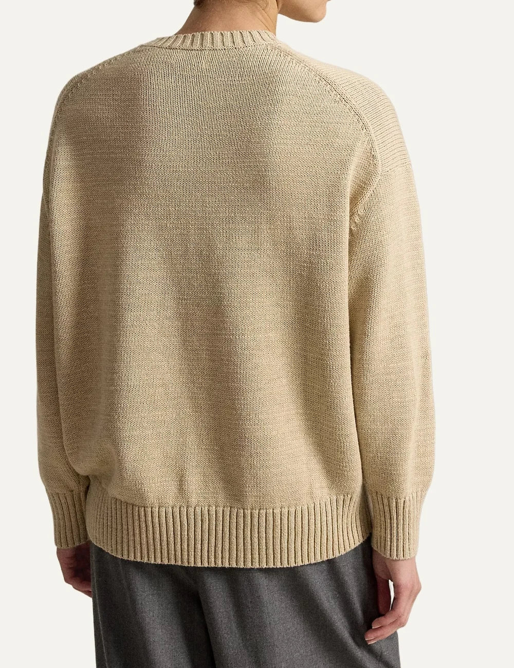 Polo Ralph Lauren men's beige cotton knit sweater featuring a Polo Bear in a shearling jacket, sunglasses and blue jeans, with ribbed trims back