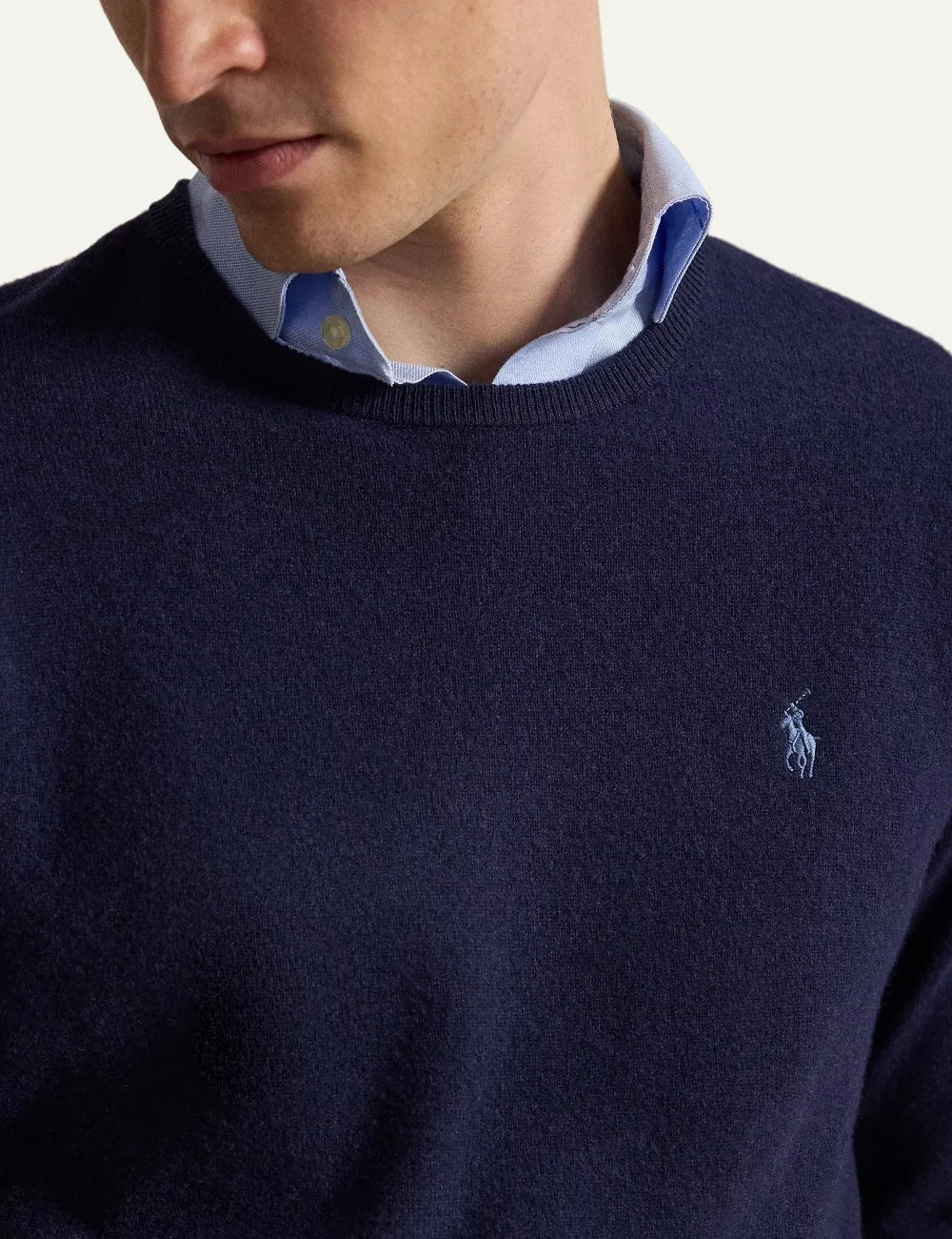 Polo Ralph Lauren men's navy blue wool crewneck sweater with long sleeves, ribbed trims and light blue embroidered Pony logo detail